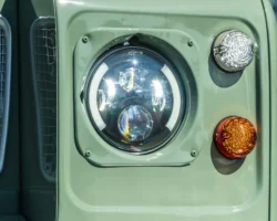 LED headlights in a classic Light Green Land Rover Series III 109.